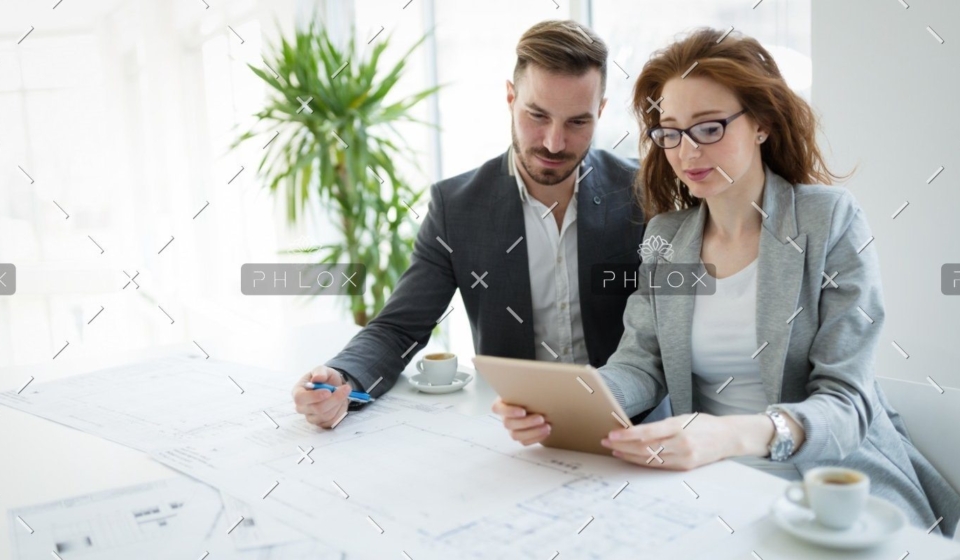 demo-attachment-818-portrait-of-young-architect-woman-on-meeting-KFZCE3A